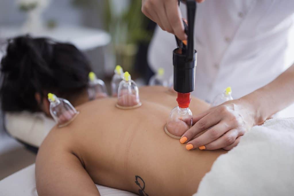 Patient having a hajamat therapy performed at therapist's office
